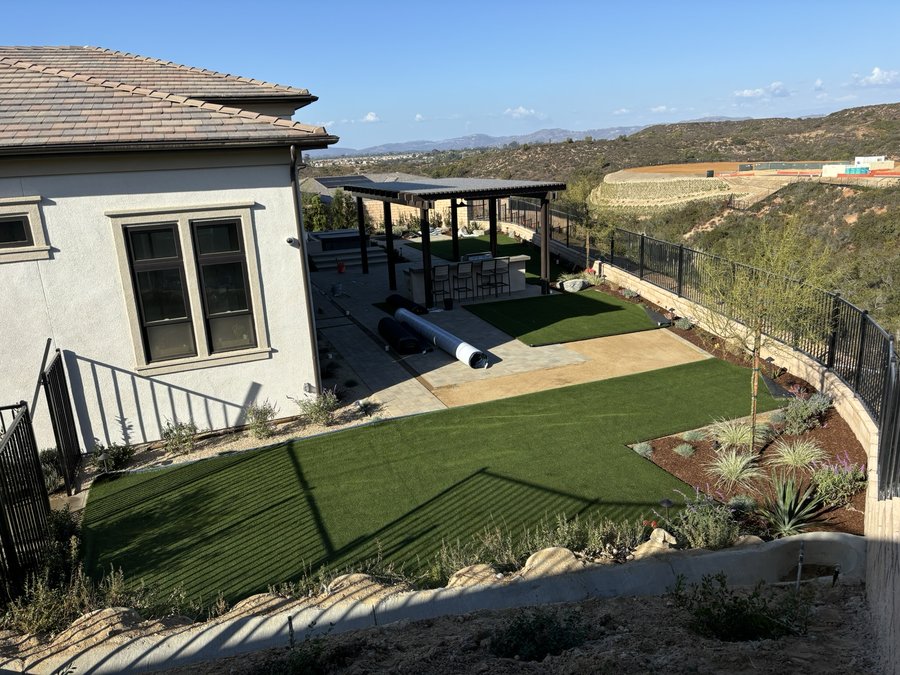 Artificial turf installation with paver pathway