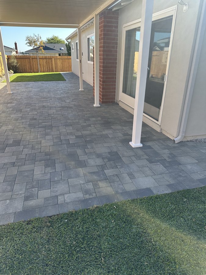 Aerial hillside paver patio and retaining wall