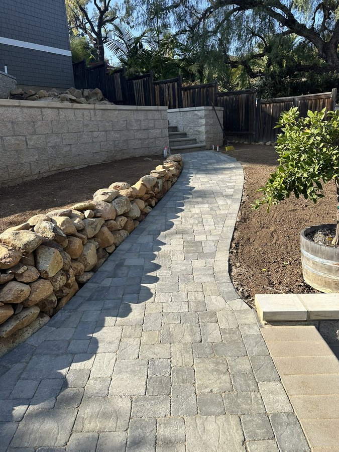 Keystone country manor brownstone retaining wall, lattice trellis, plants, irrigation and access steps