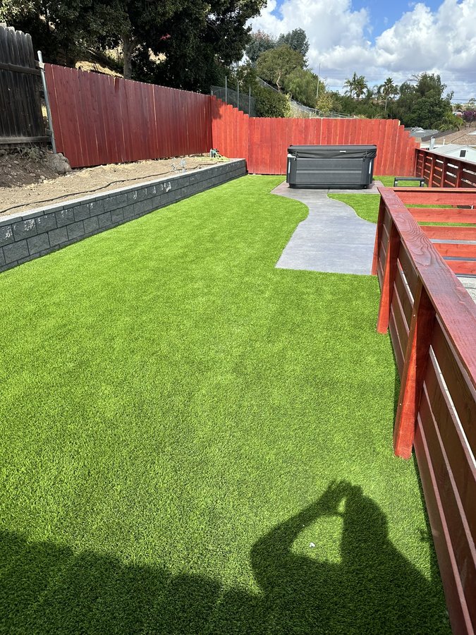 La Mesa backyard transformed from old red brick and dirt to custom turf and stamped concrete