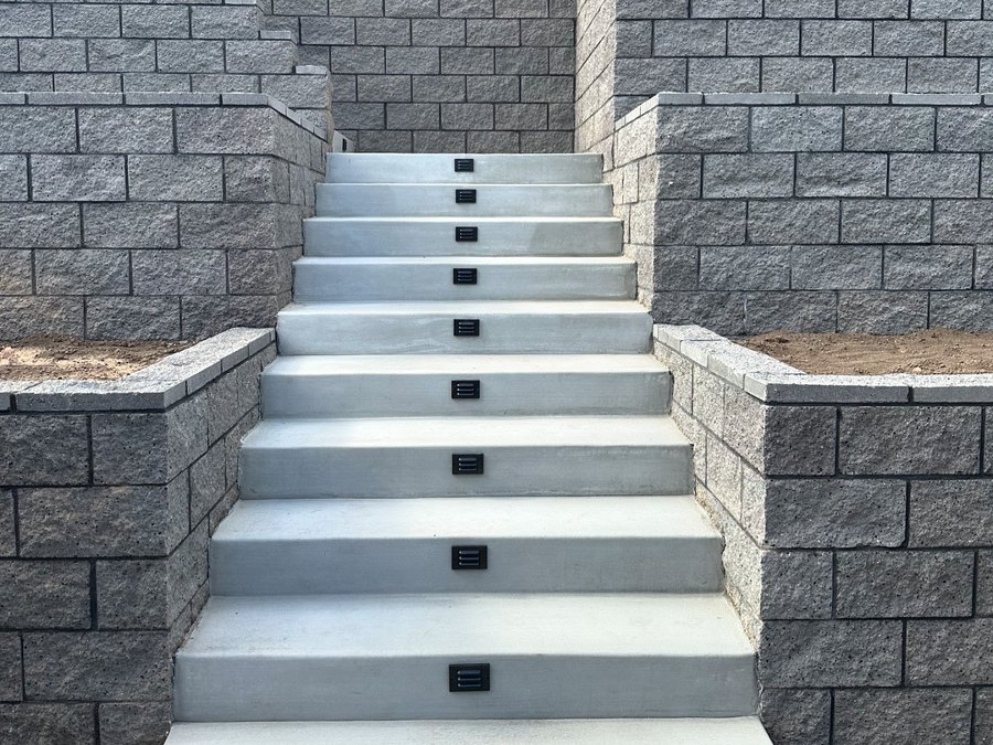 La Mesa, CA — CMU retaining wall, colored concrete design, DG and landscape across the entire front and backyard